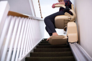 woman riding down home Stairlift