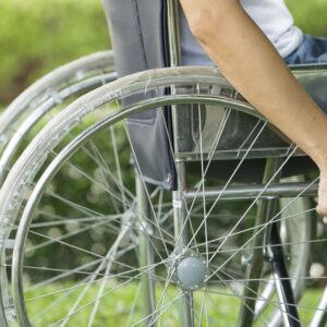 lower half view of man in a wheelchair