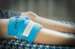 Ice pack resting on knee after surgery