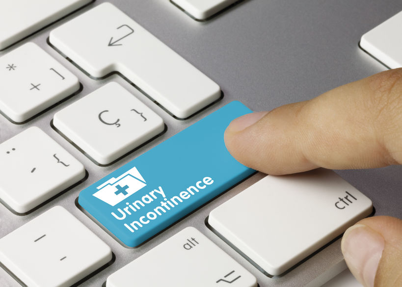 Urinary Incontinence Written on Blue Key of Metallic Keyboard. Finger pressing key.