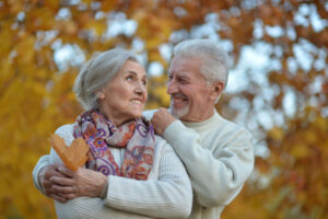 Nice elderly couple in a autumn park. High quality photo
