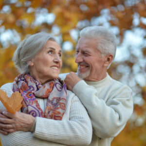 Nice elderly couple in a autumn park. High quality photo